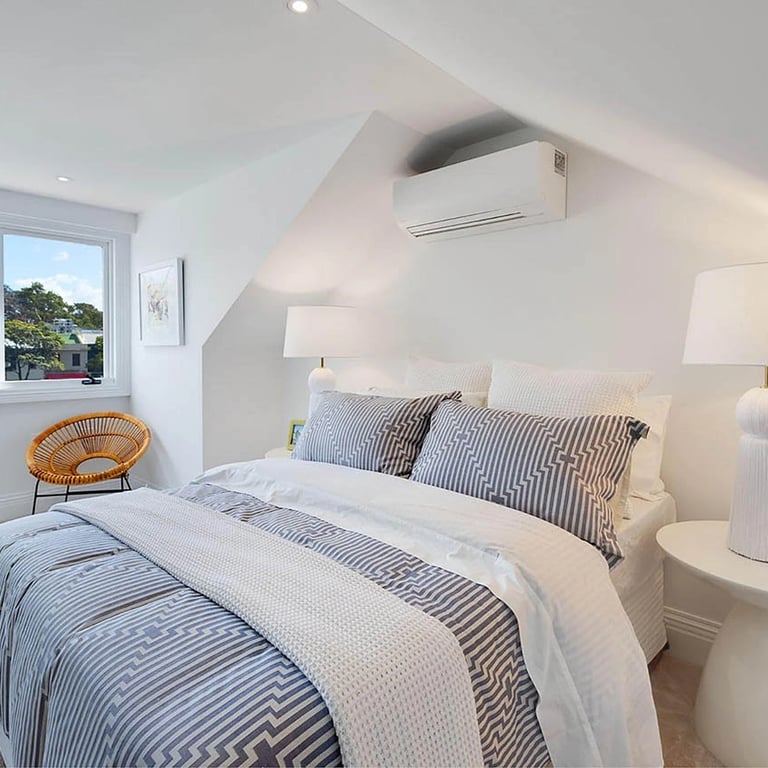 Restful bedroom blending heritage proportions with contemporary comfort and sustainable materials