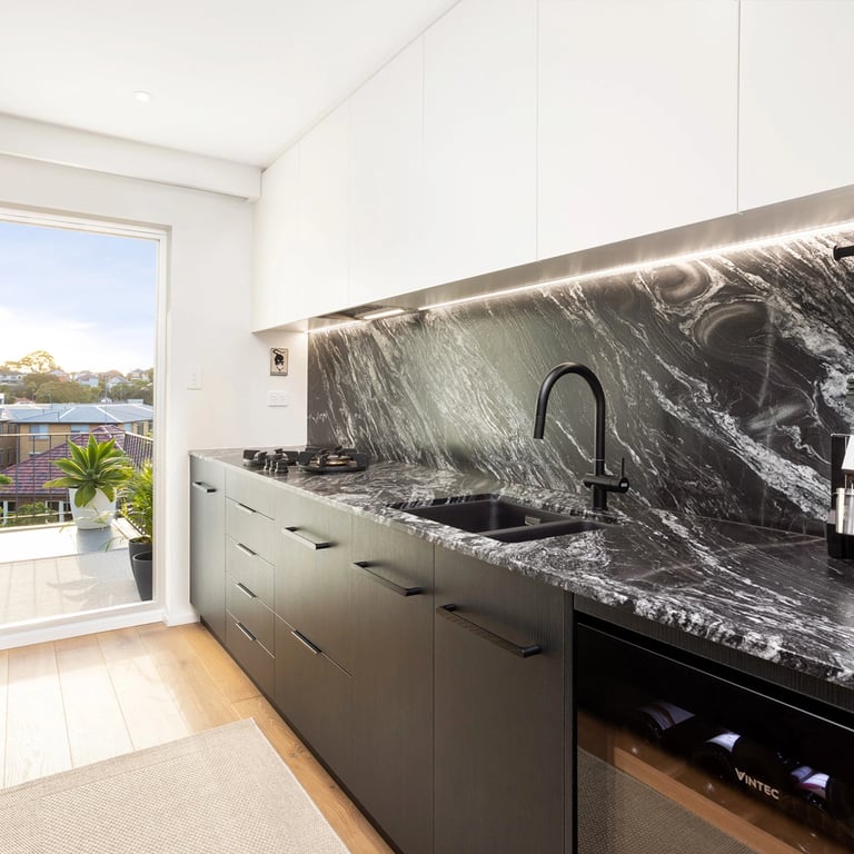 Black and White Kitchen. Black granite counter top, Black laminate versus white polyurethane cabinets
