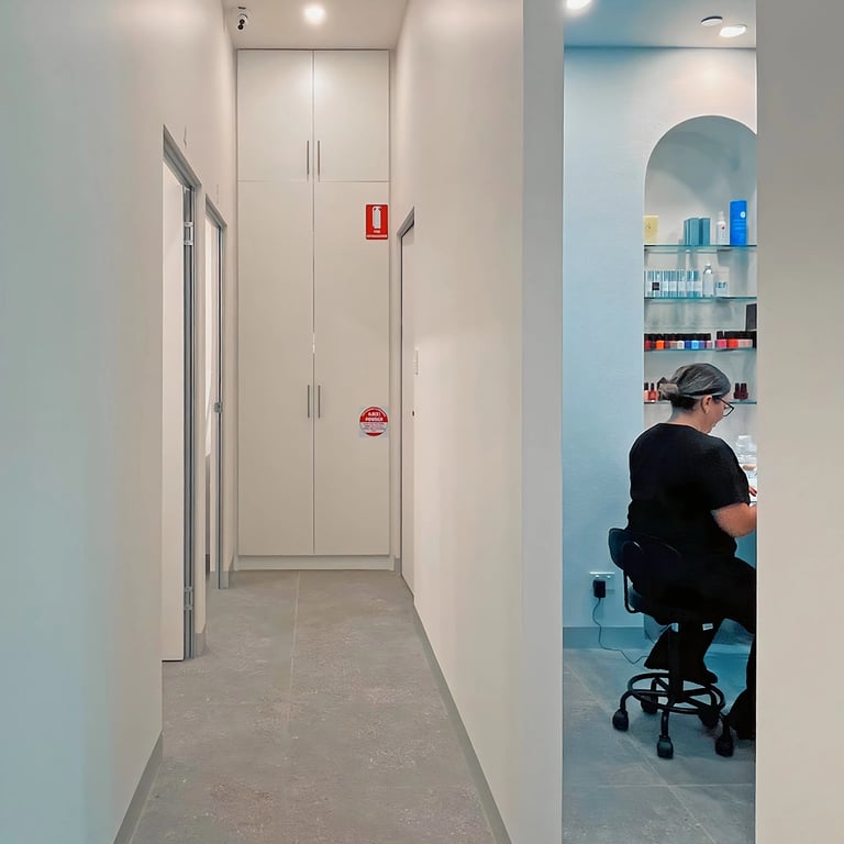 CDC compliant hallway leading to all treatment rooms. Simple, modern, features floor-to-ceiling storage cabinet