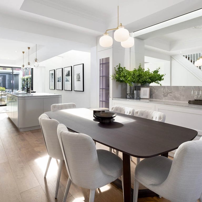 Heritage-meets-modern dining area, featuring organic curves and a cohesive material narrative.