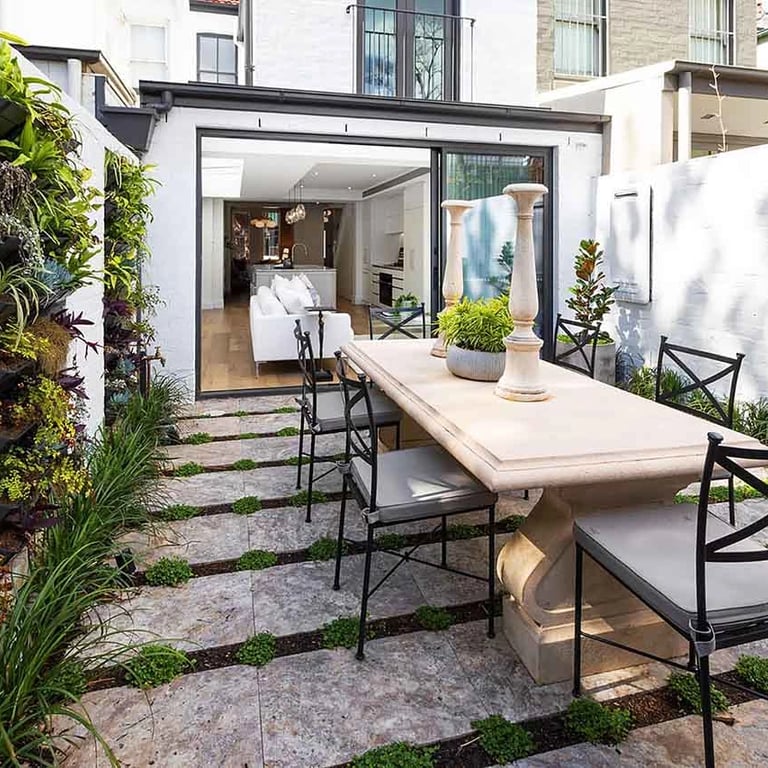 low-maintenance rear garden with vertical green walls, permeable paving, and urban biodiversity features