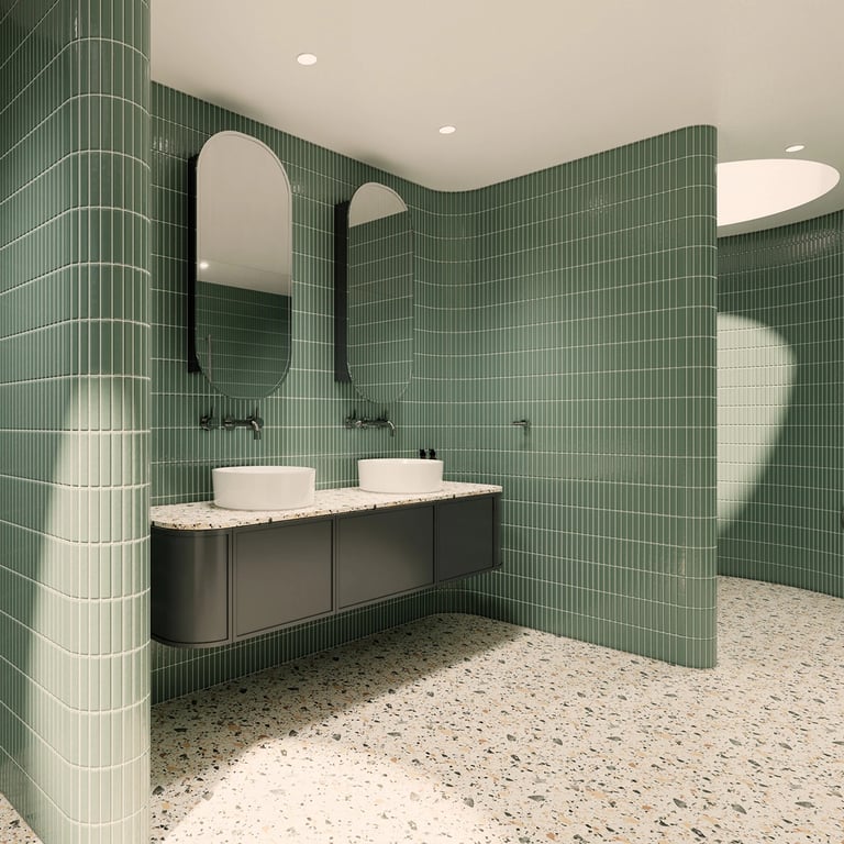 Twin arched mirros above a fluid vanity, with Kit-Kat tiled walls and a sleek, edgeless design