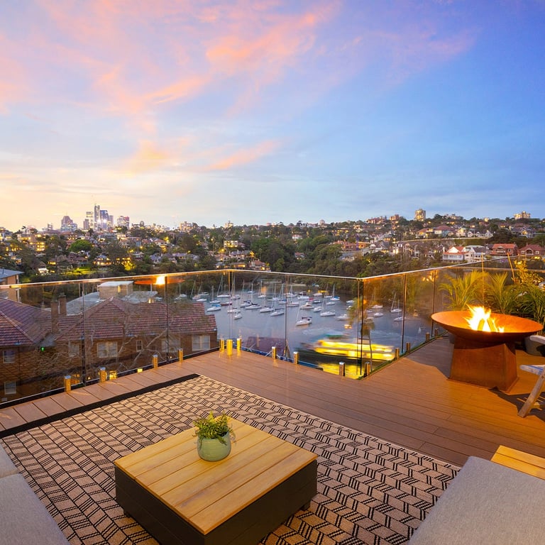 Modern architectural furniture on the rooftop terrace in Mosman, including a fireplace and timber custom furniture
