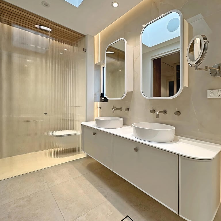 luxury master ensuite renovation in Mosman with freestanding tub, fluted glass partitions, and oak-lined ceiling