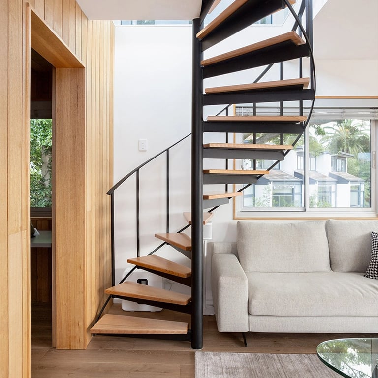custom-made metal spiral staircase with an architectural features and oak timber treads