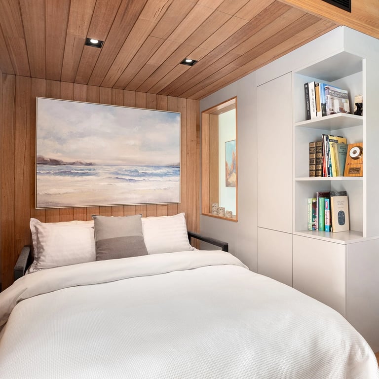 Bedroom design inspired from yacht styled cabins, finished in victorian ash timber cladding on walls and ceilings