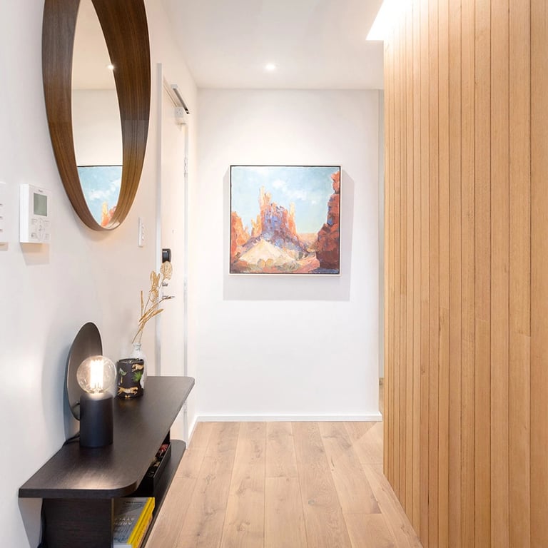 Hallway design of the penthouse located in Mosman Bay, finished in oak flooring and victorian ash wall features