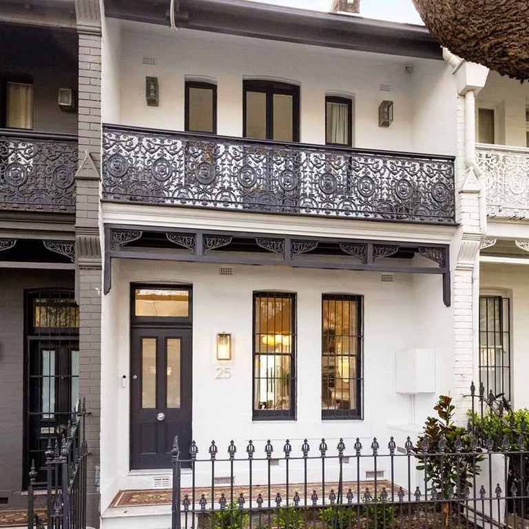 Conserved victorian terrace facade in Surry Hills, with restored timber windows and heritage facade details
