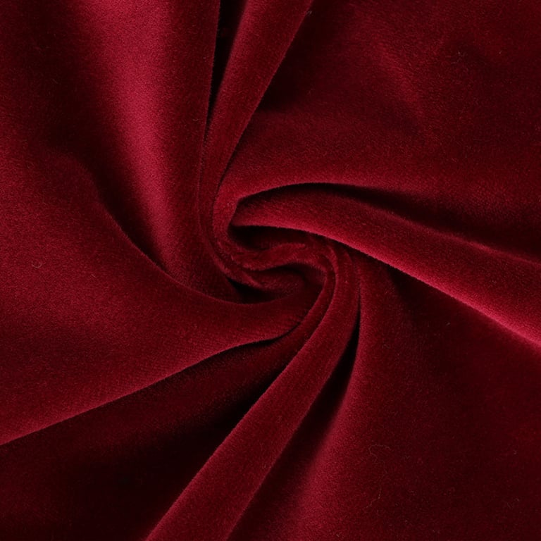 a red velvet fabric with a large, circular shaped object