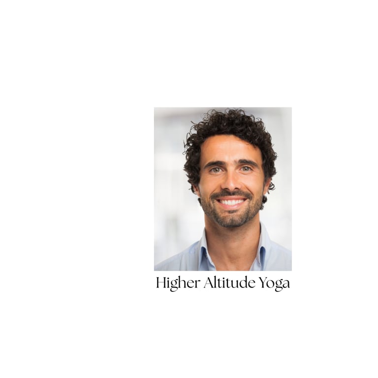 Smiling male yoga student at Higher Altitude Yoga sudio with dark curly hair and a beard.