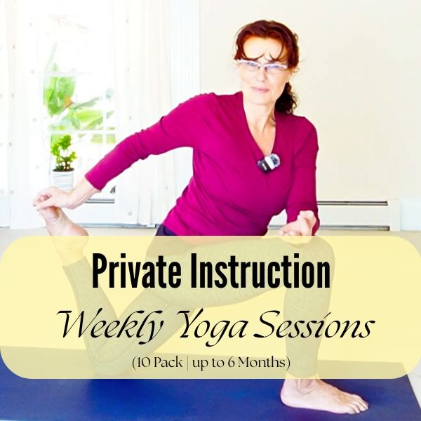 Woman smiling while practicing lunge yoga pose