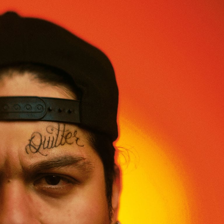 a man with a tattoo on his forehead