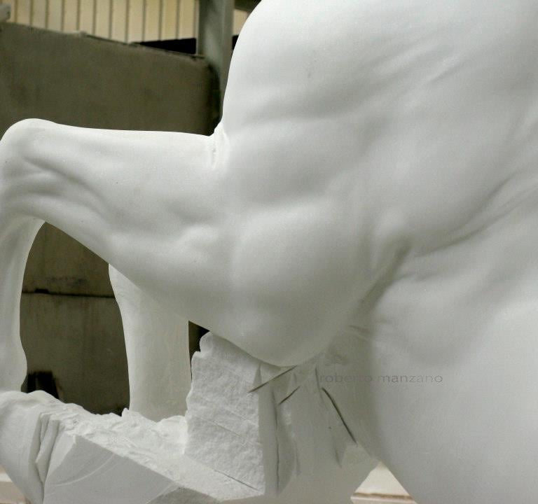 Elegant stone garden fountain featuring three rearing whitemarble horse statues in a circular basin.