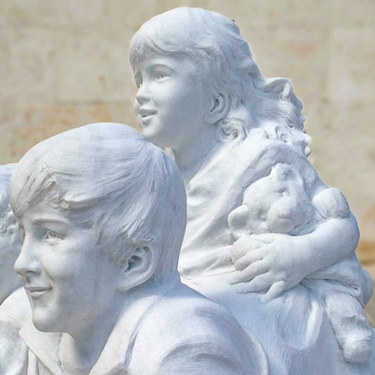 Custom white marble sculpture of three children handcrafted from a solid stone block.