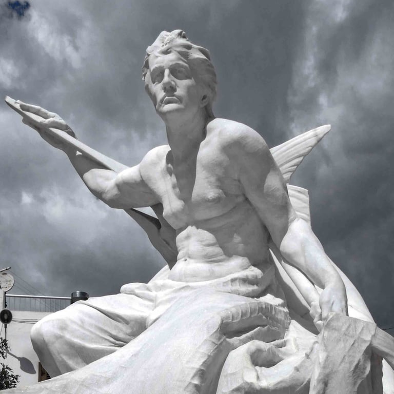 Majestic white marble sculpture of a fisherman figure against a dramatic cloudy sky.