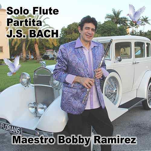 Bobby Ramirez posing with his flute and antique white car