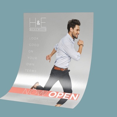 Large Format printing that have a guy running that said Now Open