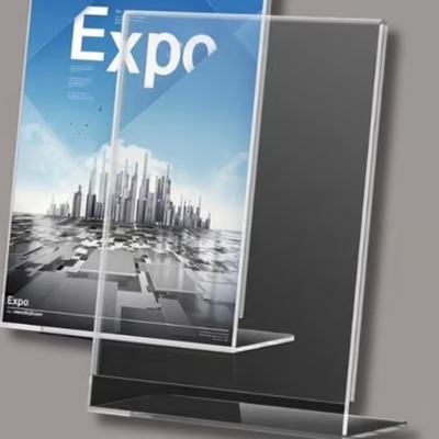 Clear L type acrylic display topper holding an Expo poster.