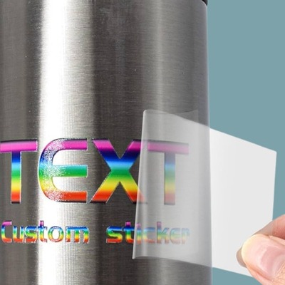 UV sticker that spelled "text" is applied to a silver tumbler
