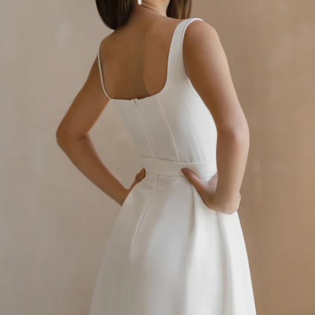 a woman in a white dress with a white dress