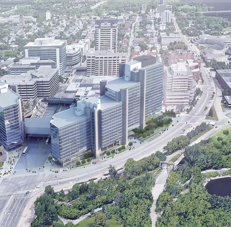 a large multi building office tower set in a city with a river running through it