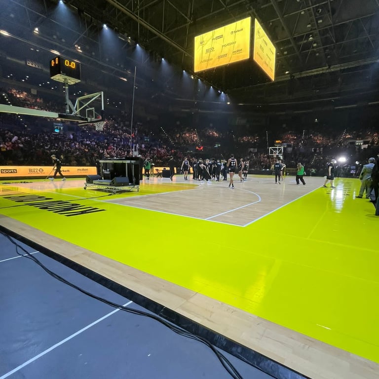 A basketball court with suspeneded LED scoreboard