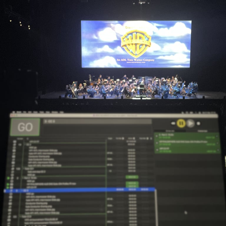 QLab media playback software being used to display a Warner Brothers film with Live Orchestra