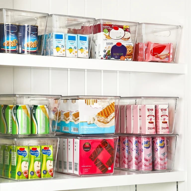 an organized pantry with a variety of different types of food in bins