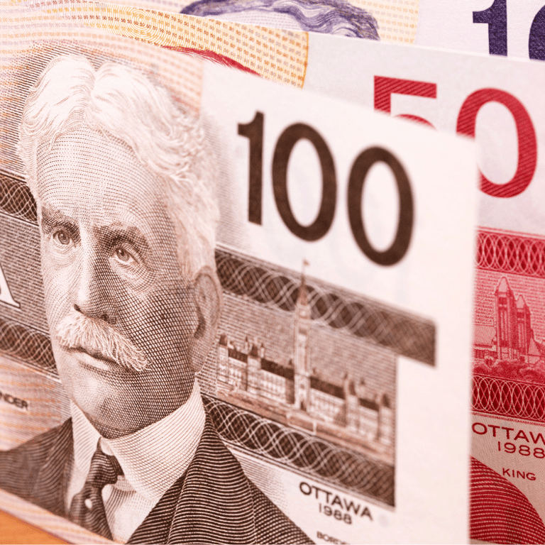 A close up of a Canadian bank note with a picture of a man