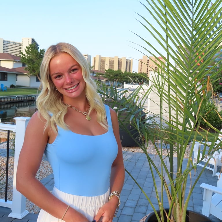 Whitney standing confidently, symbolizing her marketing career journey and personal brand.