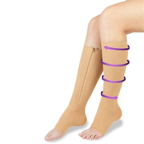 a woman's legs with a pair of knee high heel boots