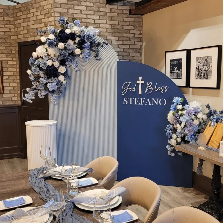 navy blue and baby blue themed baptism with floral arrangements