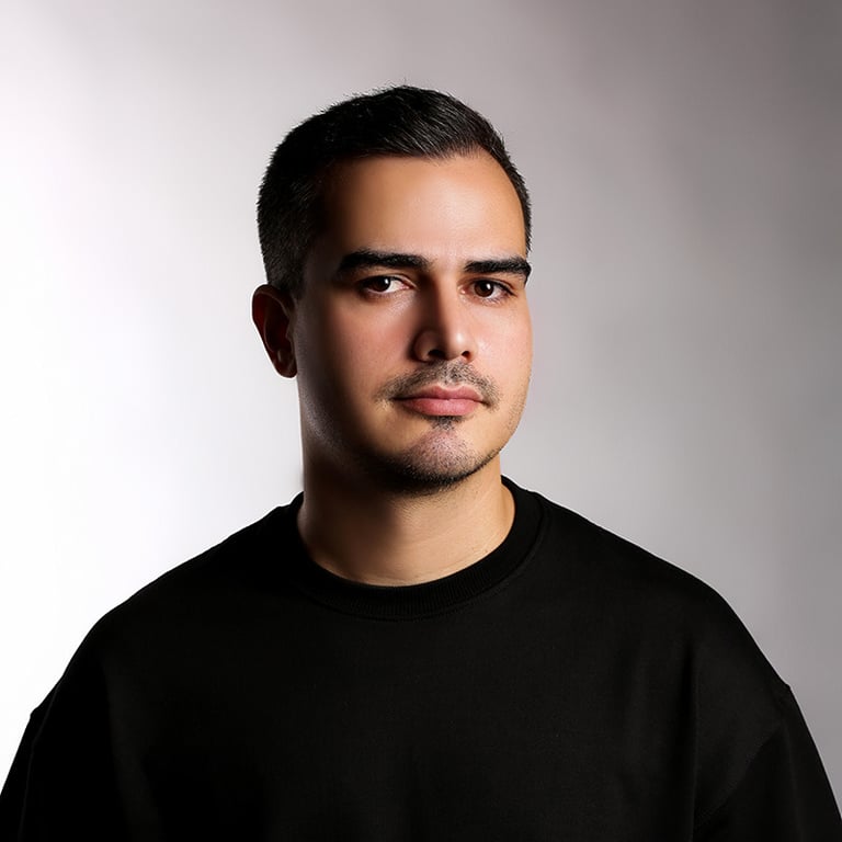 Portrait of a VISUALISE team member in a black shirt, neutral background, soft lighting, and centered composition.