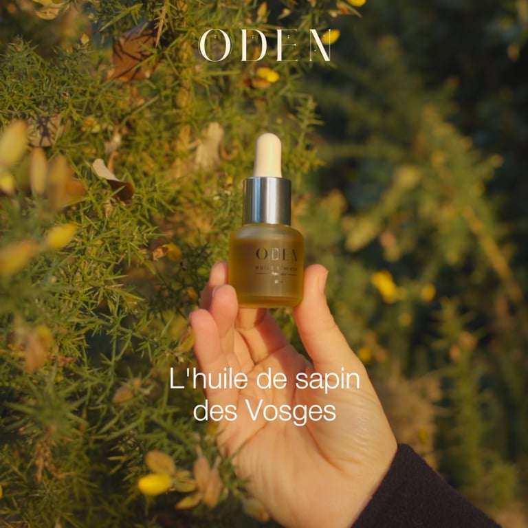 a person holding a bottle of oil and a bottle of oil