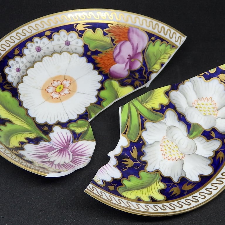 Broken New Hall floral saucer before conservation