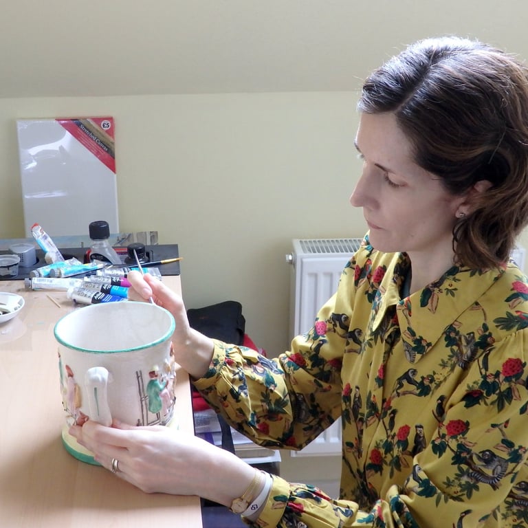 Mandy conserving a ceramic frog surprise mug