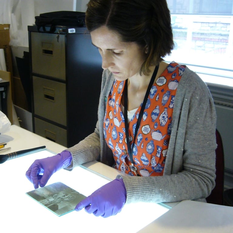 Mandy conserving a glass plate negative