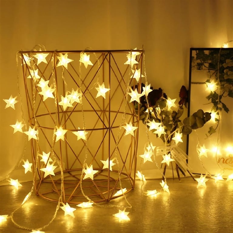 a room with a table and a vase with a star