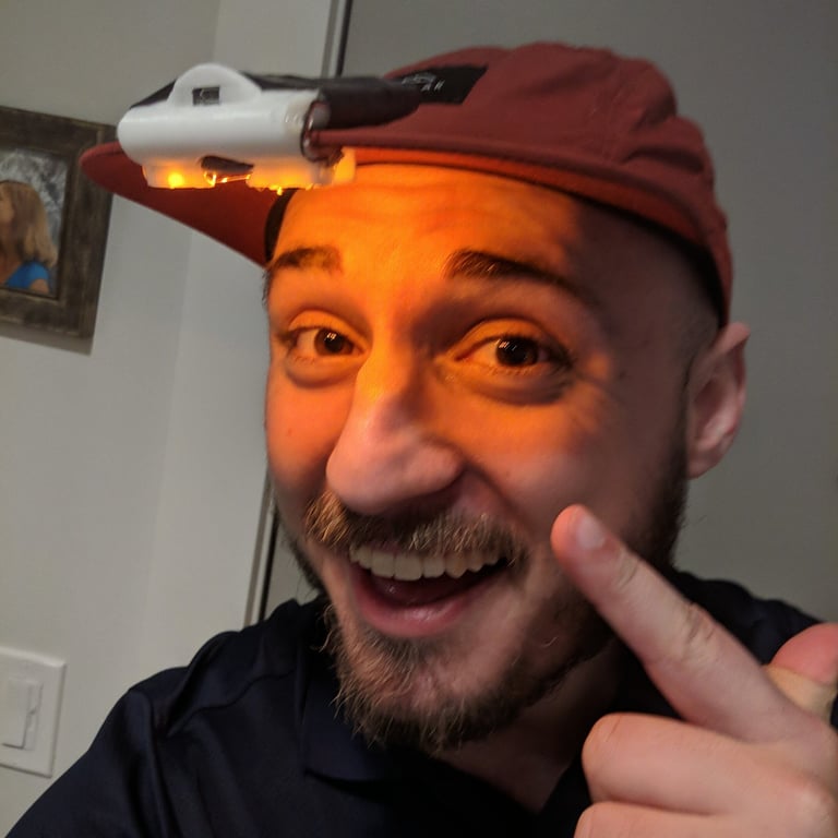 Nathan pointing to a light on his head