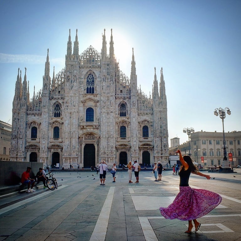 Woman twirling in front of the Duomo di MIlano