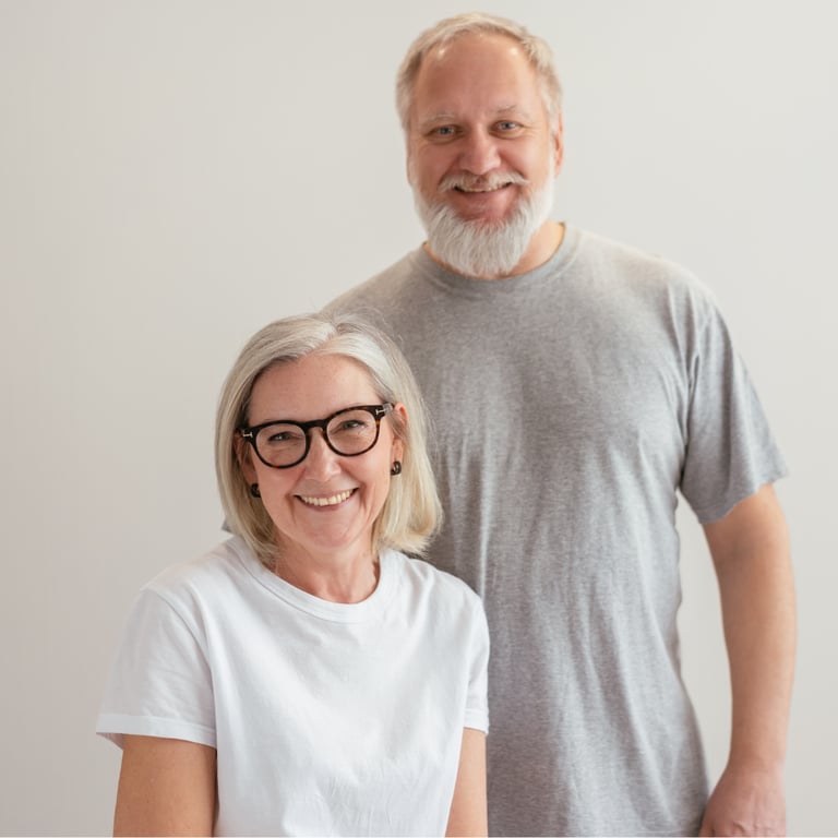 a smiling, middle-aged caucasian couple