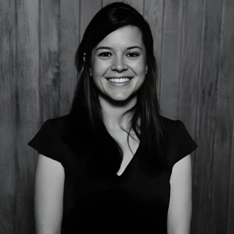 Professional psychologist smiling for a photo in formal wear