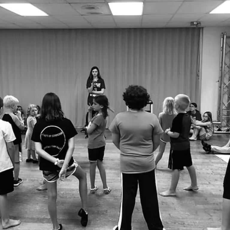 Youth director directing child actors in an adaptation of a play for KidWorks Festival.