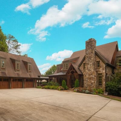 a large house with a driveway and garage