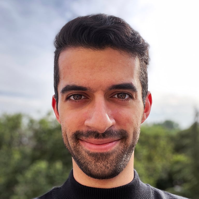 a man with a beard and a black sweater