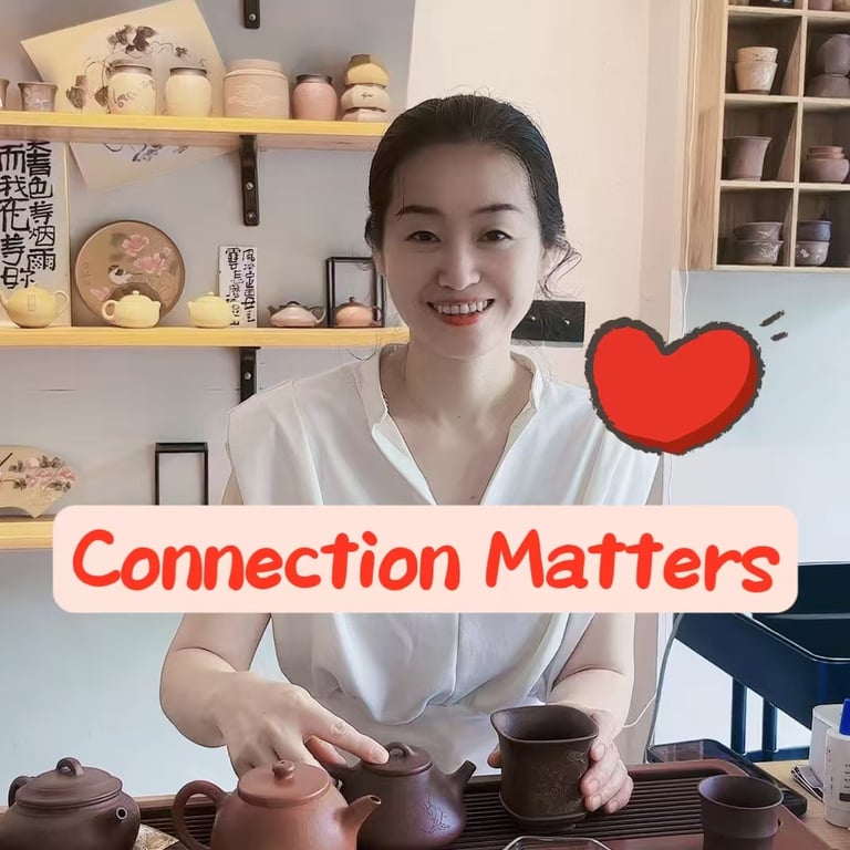 Woman smiling while holding a teapot.