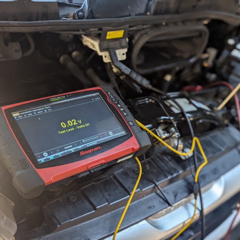 a car with a battery and a battery in the trunk of a car