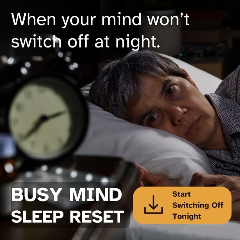 An awake person suffering from insomnia looks at a bedside alarm clock during a busy mind sleep reset.