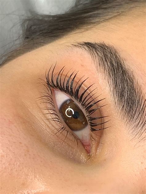 a woman with a large eyeliners and a pair of lashes