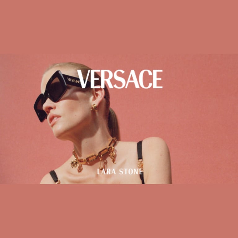 a woman wearing sunglasses versace and a necklace with a necklace